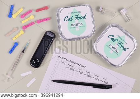 Concept For Diabetes Disease With Cats With Veterinary Cat Food, Glucometer And Syringe And Blood Su