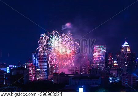 Colorful Firework With Cityscape Night Light View Of Bangkok Skyline At Twilight Time.
New Year Cele