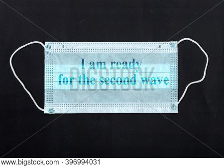 Protective Medical Mask Isolated On Black Background. Protection From Covid-19. Non-permanent Mask I
