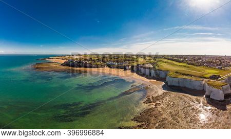 Drone aerial view of the beach and white cliffs on sunny day, Margate, England, UK