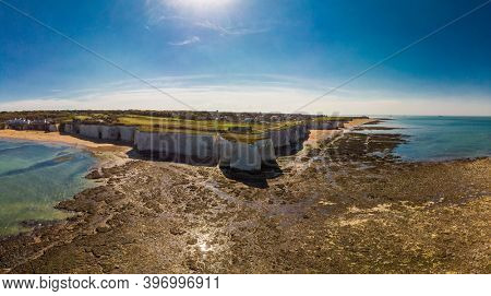 Drone aerial view of the beach and white cliffs on sunny day, Margate, England, UK