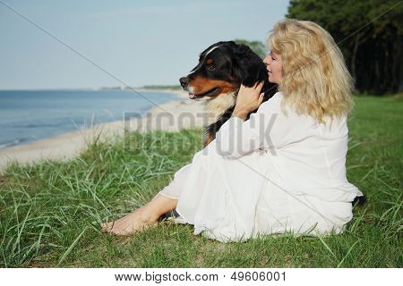 Dog And Woman Sitting