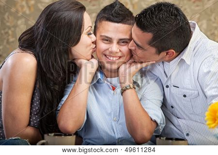 Parents Kissing Son