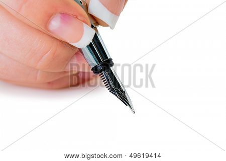 a woman signs a contract or a will with a fountain pen.