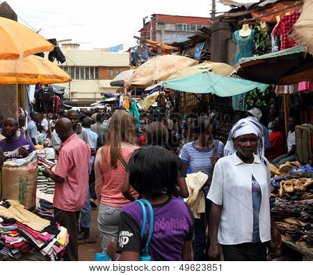 White Woman In African Market Shopping