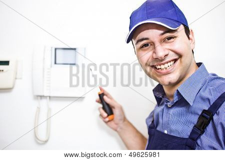 Portrait of a smiling technician at work