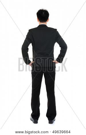 Rear or back view full body Asian business man in formal suit standing isolated on white background
