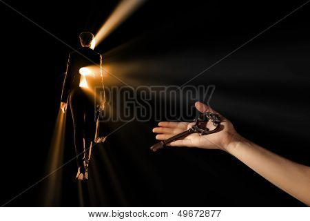 Close-up of human hand holding key. Idea concept