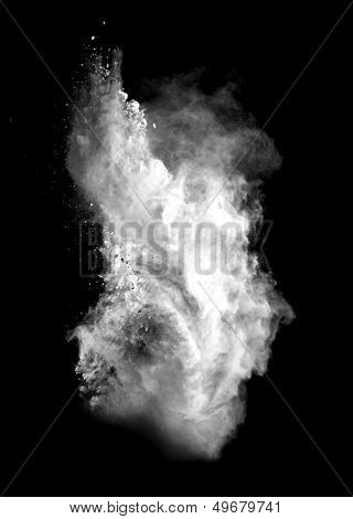 Freeze motion of white dust explosion isolated on black background