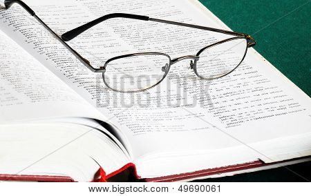 Book And Glasses