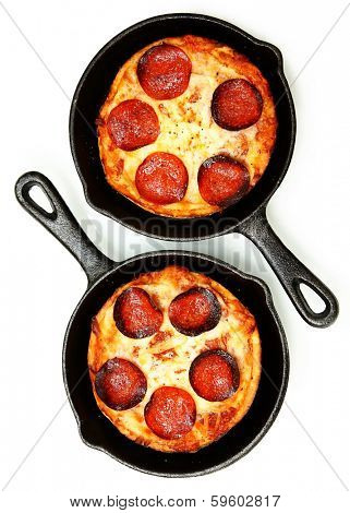 Two Single Serve Skillet Peperonni Pizzas Over White