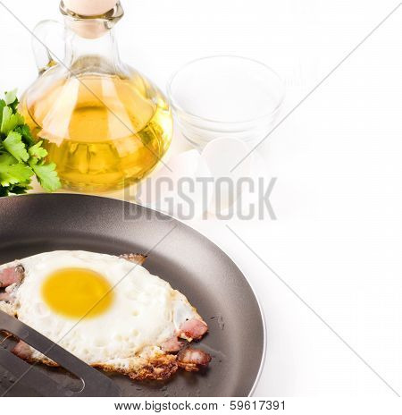 Fried eggs on a frying pan with olive oil