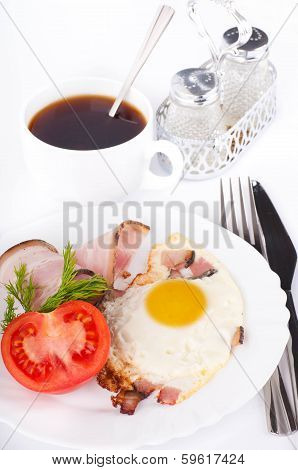 Fried eggs on a frying pan with olive oil