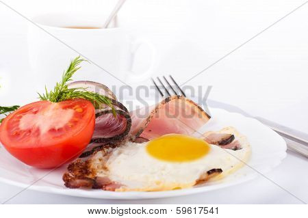 Fried eggs on a frying pan with olive oil