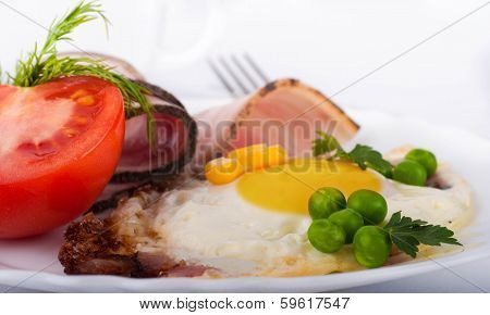 Fried eggs on a frying pan with olive oil