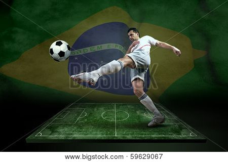 Player in action at the grunge football field. Brasil flag background.