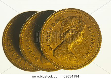 Three one pound coins