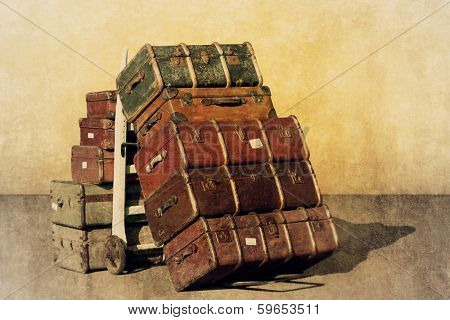 A Vintage Grunge Photograph of a Pile of Old Suitcases - Luggage 