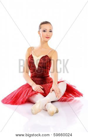 Professional bellet dancer posing at studio. Isolated over white background. 