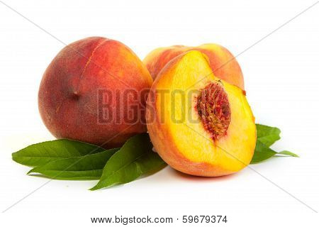 Three Perfect, Ripe Peaches With A Half  And Slices Isolated On A White Background.