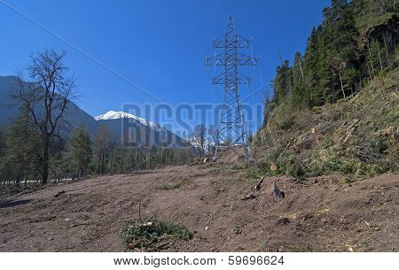 Transmission Line Under Construction In Mountains.