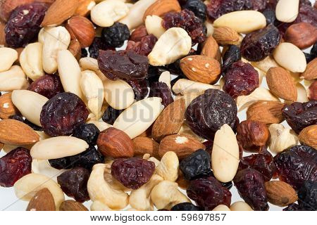 mixed nuts and dried fruits isolated on white background