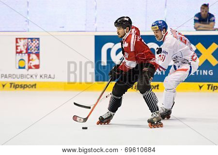 Two inline hockey players