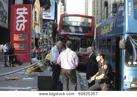 NYPD standing outside wrecked buses