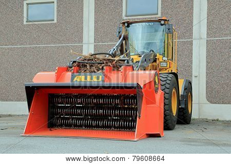 Allu Screener Crusher Bucket Mounted To A Volvo Wheel Loader