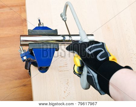 Plumber Saws Metal Trap Pipe Gripped In Vice