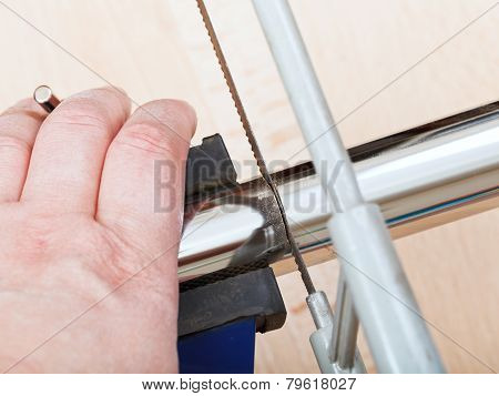 Worker Saws Trap Pipe Gripped In Vice Close Up