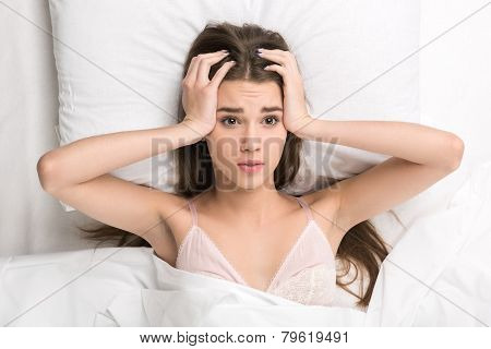beauty lying in the bed struggling to wake up