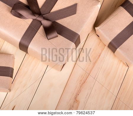 Brown Packages On A Wood Surface
