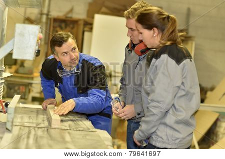 Group of students in woodwork training course 