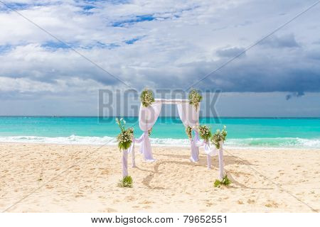 beautiful wedding arch, cabana on sand beach, outdoor beach wedding