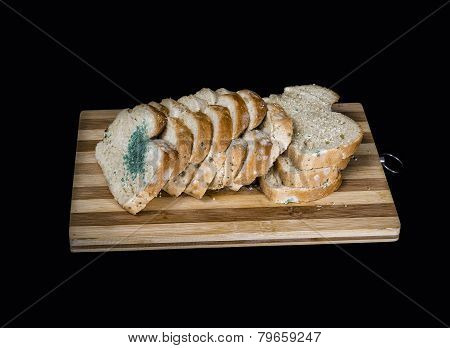 Mold Fungus On Slices Of Bread Isolated On Black  Background