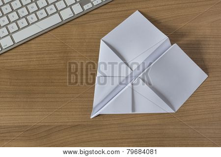 Paper Plane On An Office Desk