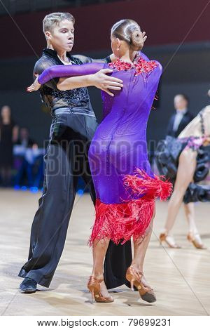 Professional belarussian dance couple of Shmidt Danila and Gumenyuk Alina performs Youth-2 Latin-Ame