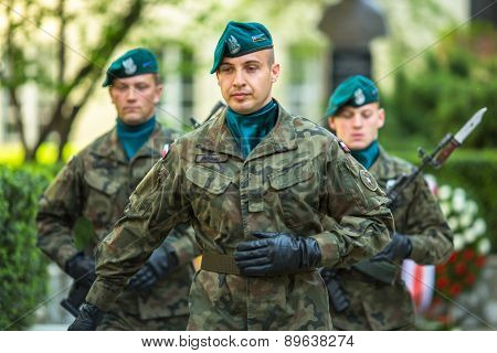 KRAKOW, POLAND - MAY 3, 2015: Polish soldiers at ceremony of laying flowers to monument to Hugo Kollataj during annual Polish national and public holiday the May 3rd Constitution Day (of May 3, 1791)