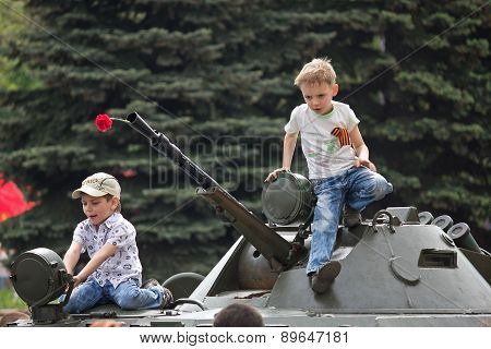 Makeevka, Ukraine - May, 9, 2012: Children On An Armored Vehicle During A Parade In Celebration Of T