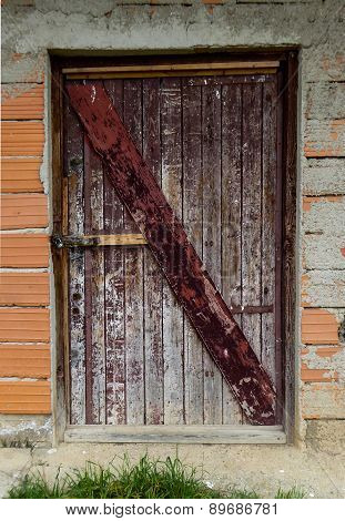Picture of an Old wooden door with peeled paint