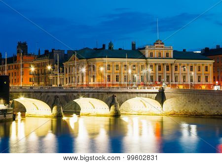 Night View Illuminated Old Norrbro Bridge in Stockholm, Sweden