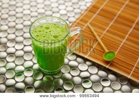 Matcha green tea from Japan on modern stainless steel background