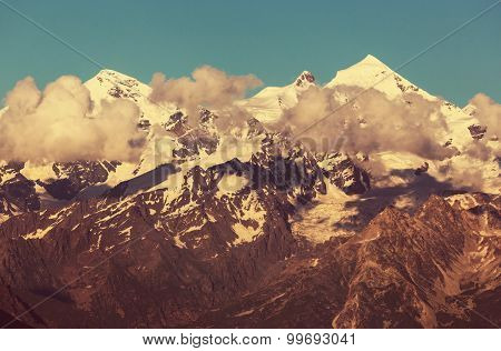 main Caucasian ridge at sunset.Tetnuld and Gestola peaks,Georgia/Instagram filter.