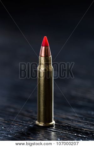 Small-caliber tracer cartridges on a dark background