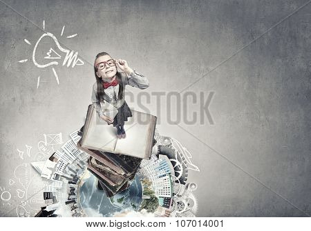 Wideangle picture of funny schoolgirl with paper plane. Elements of this image are furnished by NASA