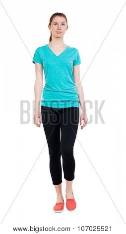 front view of walking woman.   beautiful blonde girl in motion.  backside view of person.  Rear view people collection. Isolated over white background. Sport girl in black tights comes to meet us.