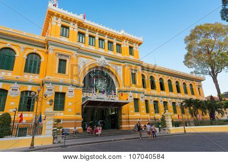 HO CHI MINH, VIETNAM, FEBRUARY 25, 2015 : Large view on the central French colonial style post office with tourists in Ho Chi Minh city (Saigon), Vietnam 