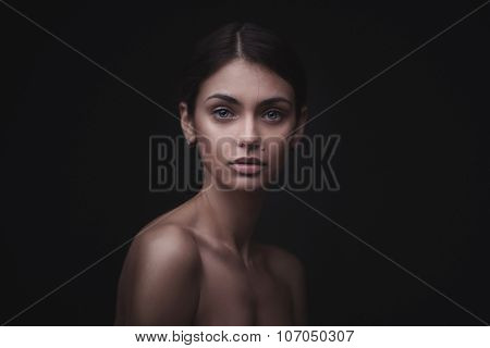 Beautiful face of young adult woman with clean fresh skin