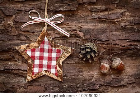 christmas decoratons with baubles on wooden background